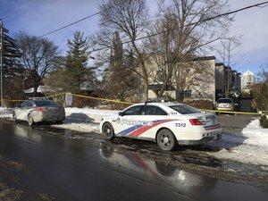 Police cars are parked outside the home of billionaire Barry Sherman on Saturday, Dec. 17, 2017 in Toronto. Sherman and his wife were found dead in the north Toronto mansion on Friday, Dec. 16.