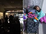 Passengers wait in a dark terminal at Hartsfield-Jackson Atlanta International Airport on Sunday following a power outage