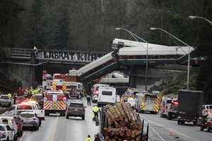 A derailed train is seen on southbound Interstate 5 on Monday, Dec. 18, 2017, in DuPont, Washington.