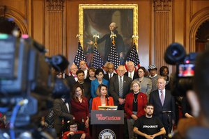 House Minority Leader Nancy Pelosi of Calif., center, speaks during attend a news conference in opposition to the Republican tax bill, Tuesday, Dec. 19, 2017, on Capitol Hill in Washington.