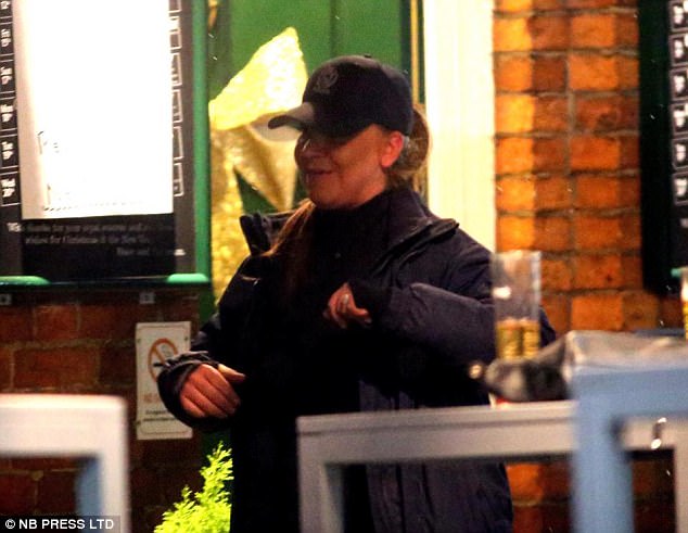 Flashing the rock: Sipping on a pint whilst fiancee Louise Gibbons proudly showed off her gold and diamond engagement ring, the 53-year-old soap star had seemed in good spirits