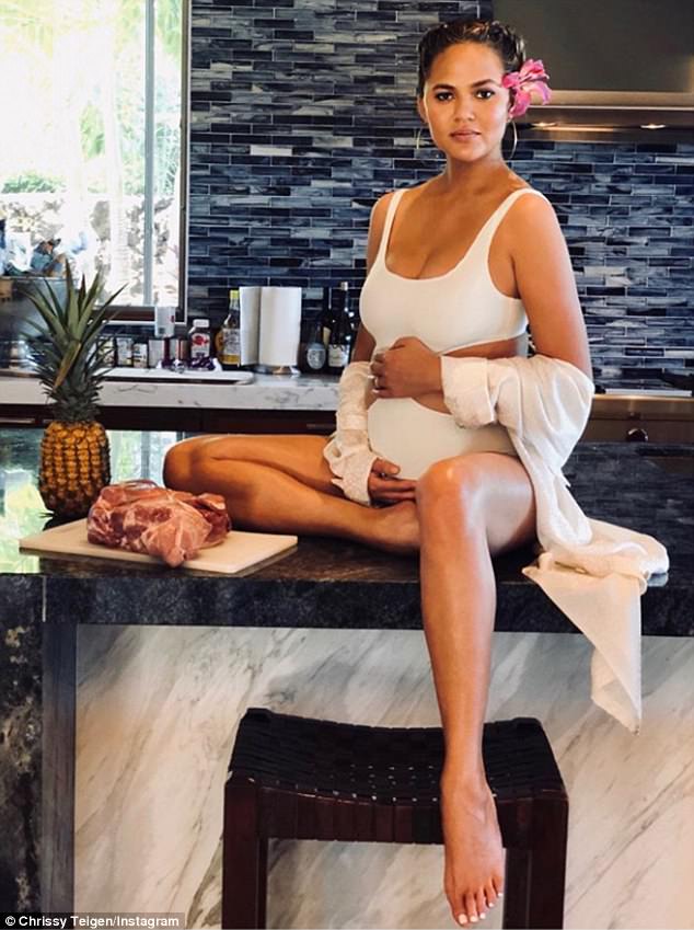 Candid: Chrissy Teigen has opened up about the struggles of pregnancy, joking that she needs 'witchcraft' to cure her horrendous headaches