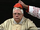 FILE - In this Thursday, Aug. 5, 2004 file photo, Cardinal Bernard Law has his skull cap adjusted during the ceremony for Our Lady of the Snows, in St. Mary Major's Basilica in Rome, Italy. An official with the Catholic Church says Cardinal Bernard Law, the disgraced former archbishop of Boston, has died at 86. Law recently had recently been hospitalized in Rome. Law stepped down under pressure in 2002 over his handling of clergy sex abuse cases. (AP Photo/Domenico Stinellis, File)