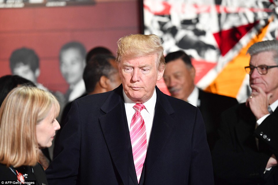 President Trump was solemn and sincere during the tour, listening intently as a museum representative took him round 