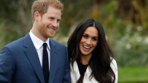 FILE - In this Monday Nov. 27, 2017 file photo, Britain's Prince Harry and his fiancee Meghan Markle pose for ...