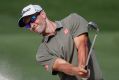 Trouble: Adam Scott hits out of the bunker on day two of the Australian PGA Championships at Royal Pines.