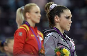 U.S. gymnast McKayla Maroney, right, stand along with Romania's gymnast Sandra Raluca Izbasa during the podium ceremony for the artistic gymnastics women's vault finals at the 2012 Summer Olympics, Sunday, Aug. 5, 2012, in London.