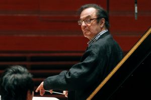 Charles Dutoit, right, performs with the Philadelphia Orchestra during a rehearsal.