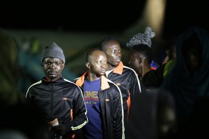 File - Nigerian returnees from Libya disembark from a plane upon arrival at the Murtala Muhammed International Airport in Lagos, Nigeria, Tuesday, Dec. 5, 2017. Hundreds of Nigerians arrived in Lagos on Tuesday, having been repatriated from Libya by the African Union (AU) amid outrage over recent footage that showed migrants being auctioned off as slaves.