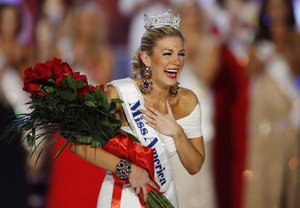 In this Jan. 12, 2013 file photo, Miss New York Mallory Hytes Hagan reacts as she is crowned Miss America 2013 in Las Vegas. Some former Miss Americas shamed in emails from the pageant’s CEO are calling on him and other leaders of the Miss America Organization to resign