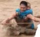 Villagers carry an elderly woman across raging flood waters in Lanao del Norte, southern Philippines. 