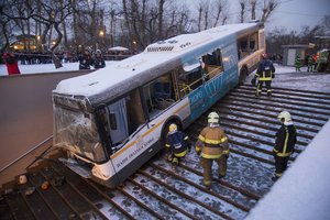 Rescuers work at the scene of a bus crash in Moscow, Russia, Monday, Dec. 25, 2017.