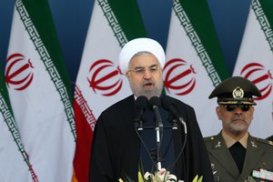 Iranian President Hassan Rouhani speaks at a military parade marking National Army Day in front of the mausoleum of the late revolutionary founder Ayatollah Khomeini, just outside Tehran, Iran, Saturday, April 18, 2015.