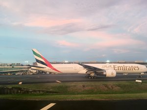 Emirates Airline plane at an international airport runway. Taken on May 2017.