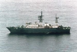 Aerial port side view of the Russian Navy Vishuaya class intelligence collection ship SSV-169 conducting surveillance operations of NATO exercise Solid Stance 93. 		 		%lt;table