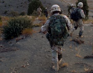 US Army (USA) Soldiers assigned to the 20th Special Forces Group (SFG), Operational Detachment Alpha (ODA) 342 and Afghanistan Military Forces (AMF) Soldiers patrol through the mountains near Orgun, located in the Paktika province of Afghanistan.