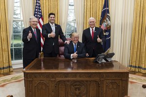 President Donald J. Trump celebrates the passage of the Tax Cuts Act with Vice President Mike Pence, Senate Majority Leader Mitch McConnell, and Speaker of the House Paul Ryan, White House, Washington, D.C. US, December 20, 2017