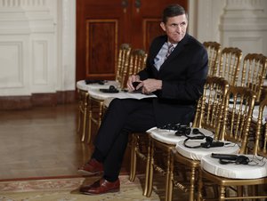 National Security Adviser Michael Flynn sits in the front row before the start of the President Donald Trump and Japanese Prime Minister Shinzo Abe joint new conference in the East Room of the White House, in Washington, Friday, Feb. 10, 2017.