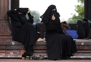 Indian Muslim women rest inside Jama Masjid in New Delhi, India, Tuesday, Aug. 22, 2017.