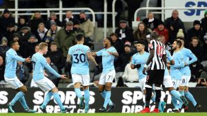 Manchester City's Raheem Sterling, center, celebrates with teammates after scoring his side's first goal of the game ...