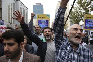 Iranian demonstrators chant slogan in an annual rally marking the anniversary of the 1979 U.S. Embassy takeover, in Tehran, Iran, Saturday, Nov. 4, 2017.