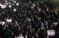 Iranian protesters chant slogans at a rally in Tehran, Iran.