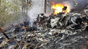 This photo released by Costa Rica's Civil Aviation press office shows the site of a plane crash in Punta Islita, Guanacaste, Costa Rica, Sunday, Dec. 31, 2017.