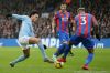 Manchester City's Leroy Sane, left, competes for the ball with Crystal Palace's Patrick van Aanholt during the English ...