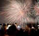 Filipino revelers watch as fireworks light up the sky to welcome the New Year at the seaside Mall of Asia in suburban ...