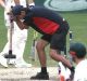 Running repairs: A groundsman takes a sledgehammer to the MCG pitch during the Boxing Day Test.