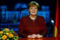 German Chancellor Angela Merkel poses for photographs after the television recording of her annual New Year's speech.