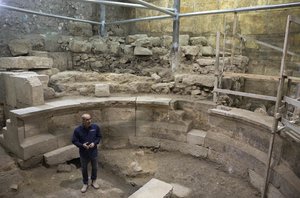 Israel's Antiquities Authority's Dr. Joe Uziel stands in an ancient Roman theater-like structure in the Western Wall tunnels in Jerusalem's old city, Monday, Oct. 16, 2017. Israeli archaeologists have announced the discovery of the first known Roman-era theater in Jerusalem’s Old City, a unique 1,800-year-old structure abutting the Western Wall that is believed built during Roman Emperor Hadrian’s reign. (AP Photo/Sebastian Scheiner)