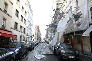 A scaffolding collapsed due to a violent windstorm, in Paris, Wednesday, Jan. 3, 2018, as France's national electricity provider reports 200,000 households without electricity across the country, including 30,000 in the Paris region due to storm damage.