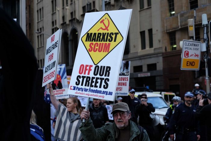 Reclaim Australia protester holds up sign at Sydney rally