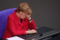 Negotiating a coalition has been a headache for Angela Merkel. 