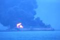 In this photo provided by Korea Coast Guard, the Panama-registered tanker Sanchi is seen ablaze after a collision with a ...