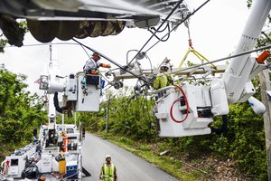 Prime Power transmission and distribution specialists assigned to Company D, 249th Engineering Battalion, repair power lines in Rio Grande, Puerto Rico, Oct. 19, 2017