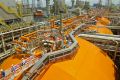 Crew members walk on board a floating liquefaction vessel built by Keppel Offshore and Marine.