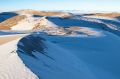 Sand dunes in the Sahara covered in snow.