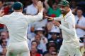 The turning point: Nathan Lyon (right) celebrates with David Warner after running out James Vince at the Gabba in the ...