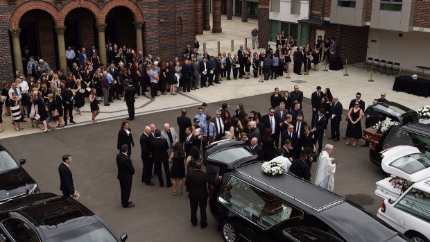 The crowd gathers outside the church after the funeral of Annabelle Falkholt and her parents Lars and Vivian Falkholt at ...