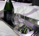 Champagne sits on a business class seat of a Singapore Airlines Ltd. Airbus SE A380 aircraft with refitted cabins during ...