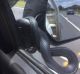 Nolan's Auto Parts Pambula employee Ted Ogier didn't expect to see a snake on his car's side mirror when driving along ...