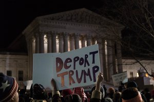 Deport Trump sign, Supreme Court news conference to call for the reversal of President Trump’s travel ban on refugees and immigrants from several Middle East countries, 31/1/2017 in US