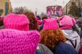 Women wearing knitted "pussy hats" to protest the election of Donald Trump.