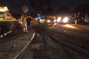 Army Sgt. Charles Sears, left, talks with a local law enforcement officer in Montecito, Calif., Jan. 10, 2018. A storm-driven mudslide rushed through parts of the city earlier in the week.