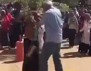 Qassim Badri attacks a student