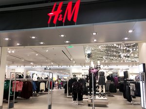 H&M fashion store features an open plan with vast choices of clothing, and apparel. Taken on November 2017.