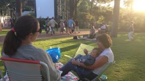 Families enjoy a night at the movies.