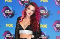 Bella Thorne arrives at the Teen Choice Awards at the Galen Center on Sunday, Aug. 13, 2017, in Los Angeles. 